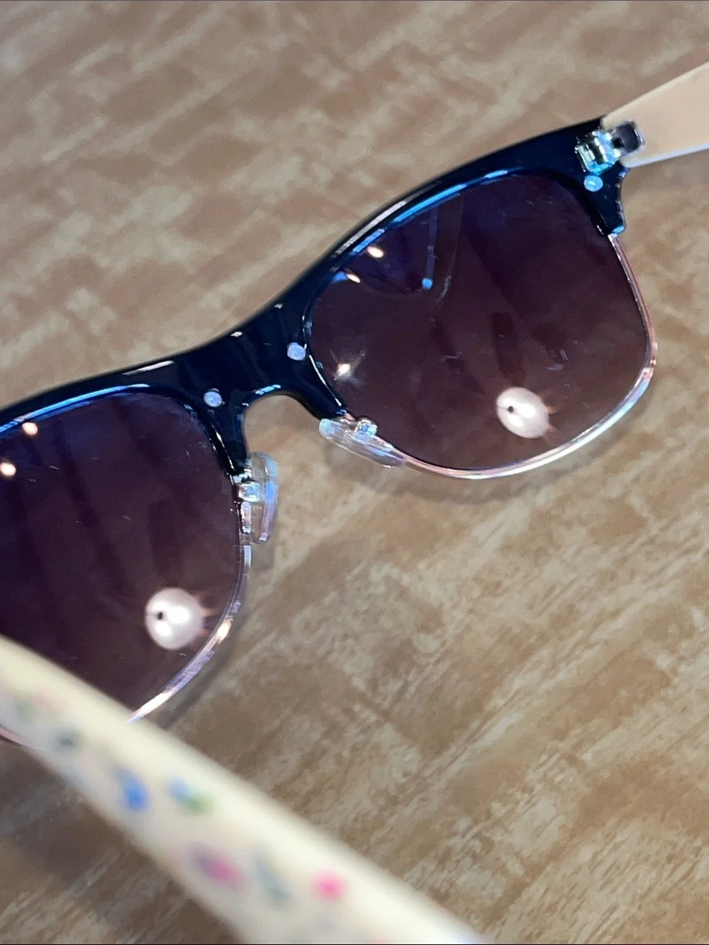 Disney Black and Cream Sunglasses with Alice in Wonderland theme